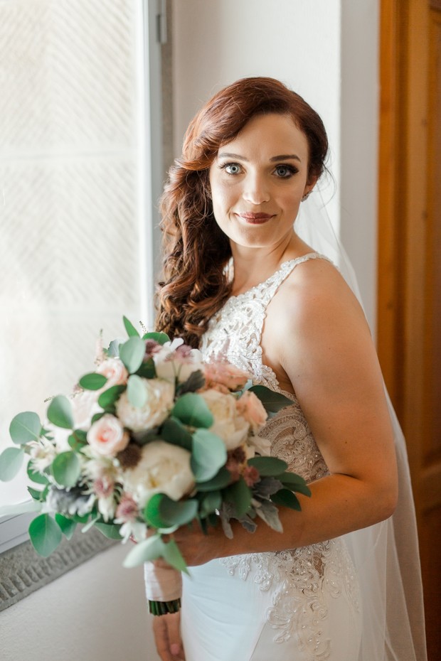 bride with side swept wedding hairstyle