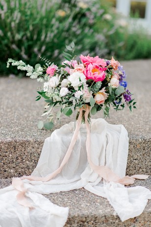 Elegant bridal bouquet with pink peonies and silk ribbons
