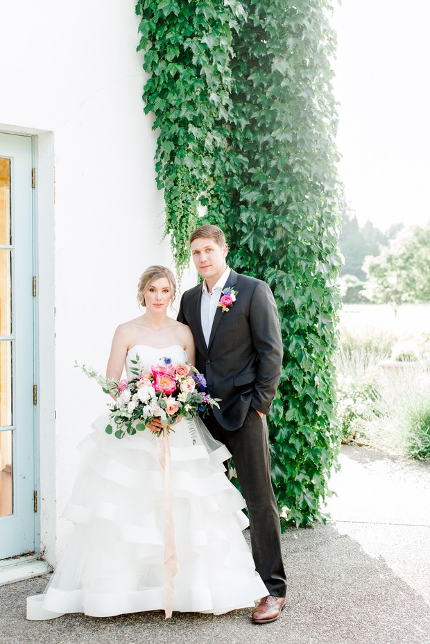 Elegant wedding portrait with bride bouquet and groom
