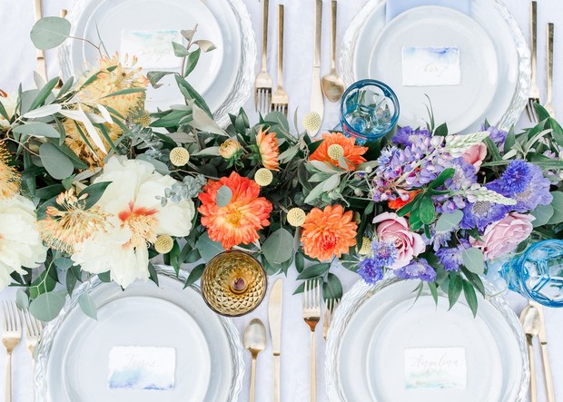 Elegant wedding table setting with colorful floral centerpiece