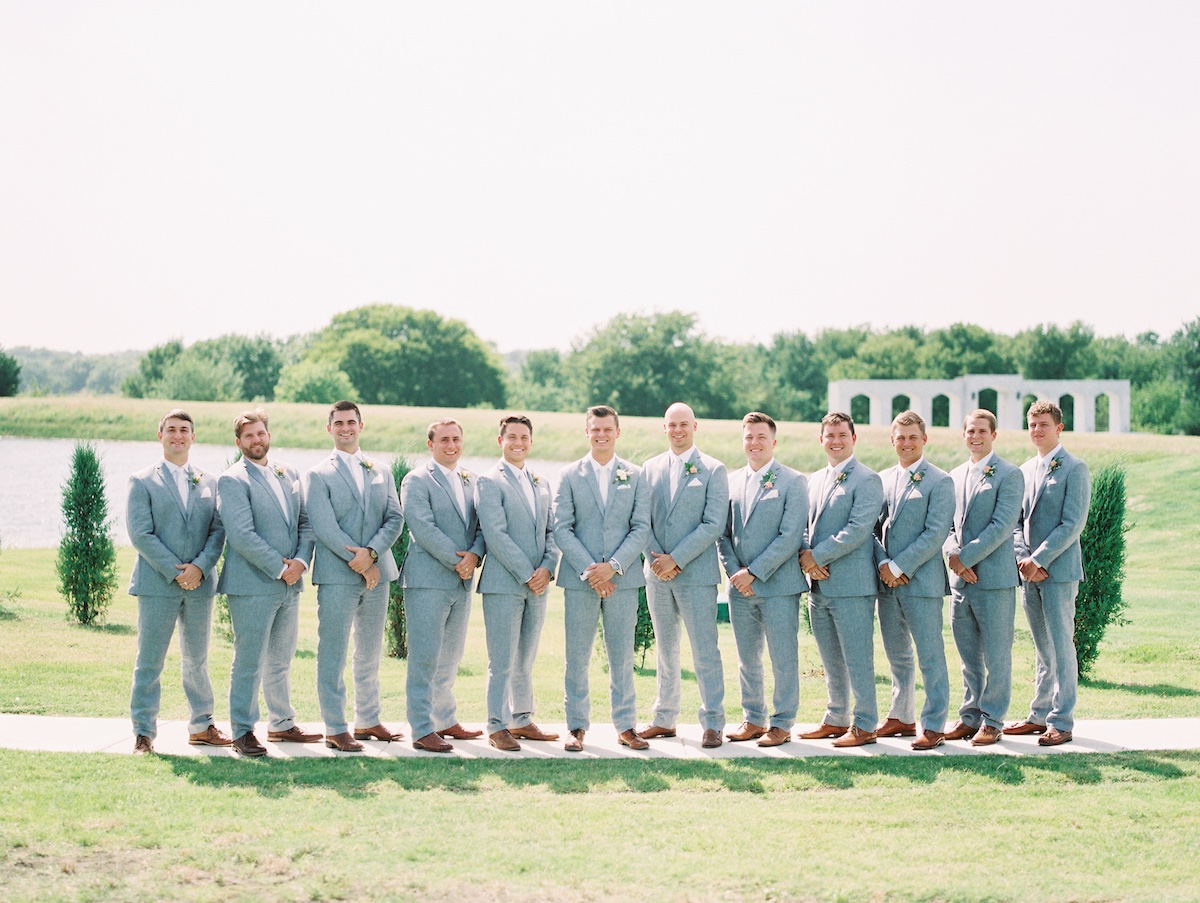 groom and groomsmen in soft grey