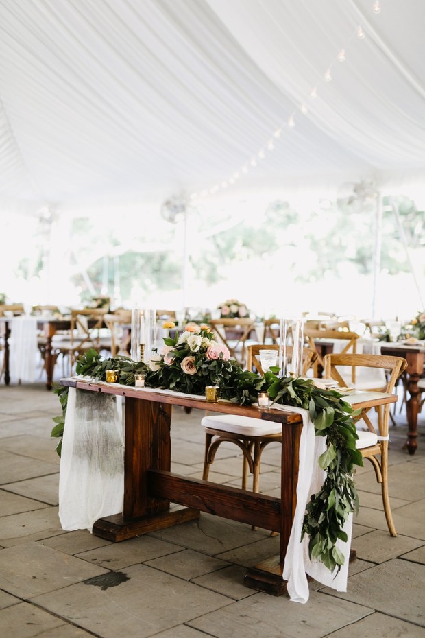 Elegant rustic wedding reception table with floral decor