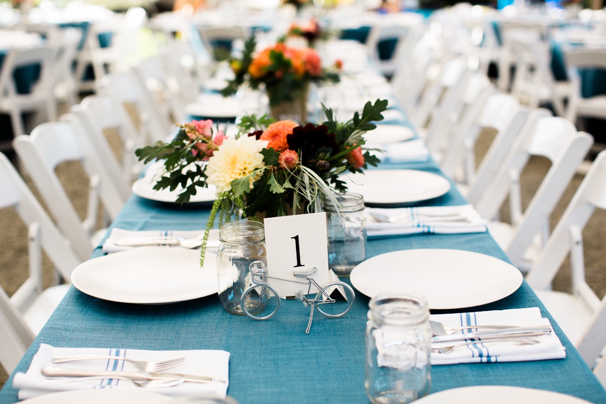 Elegant wedding reception table setting with floral centerpiece