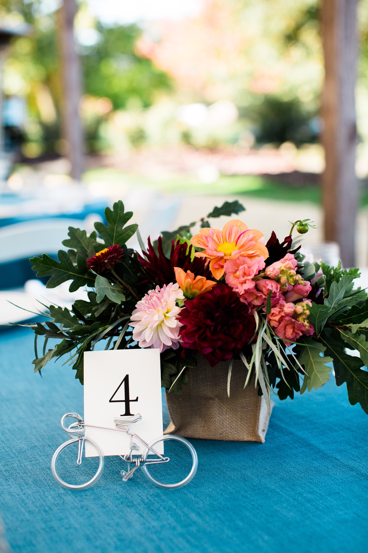 Wedding table centerpiece with floral arrangement and bike