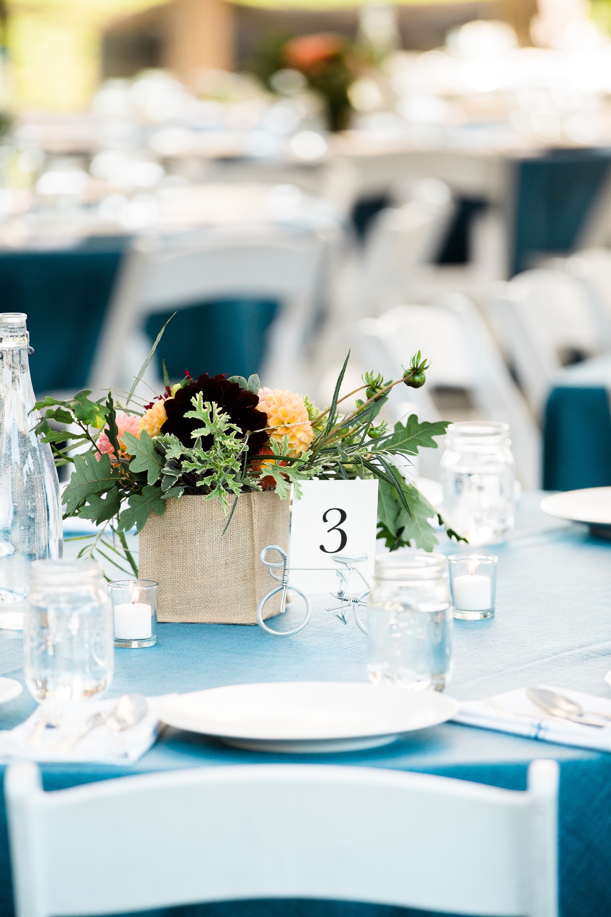 Elegant outdoor wedding table setting with floral centerpiece