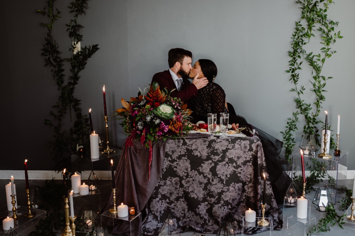 dark and moody wedding sweetheart table