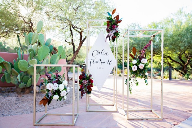 floating floral and and modern wedding sign