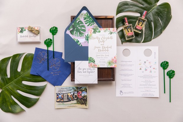 Floral and tropical themed wedding invitation suite
