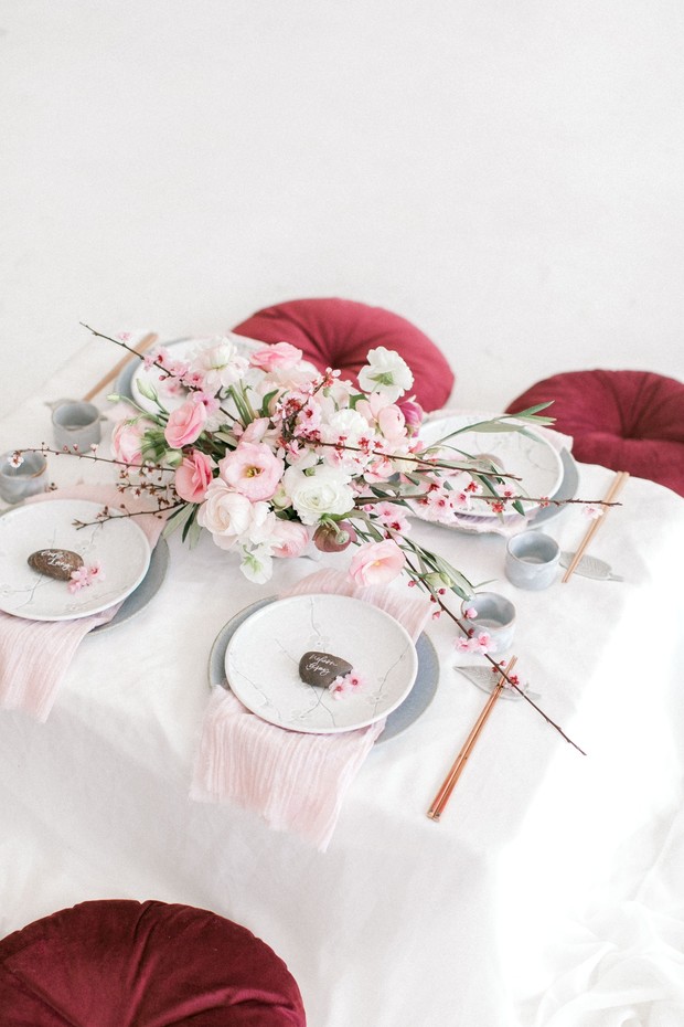 Elegant pink floral centerpiece on Japanese style table setting