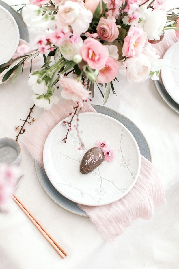 Elegant place setting with pink flowers and stone name card