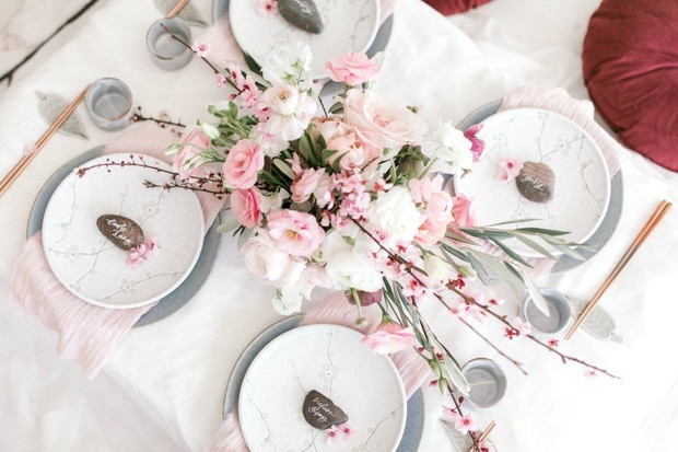 Elegant table setting with pink flowers and place cards