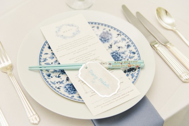 white and blue wedding place setting