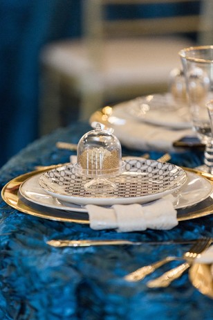 gold and blue place setting