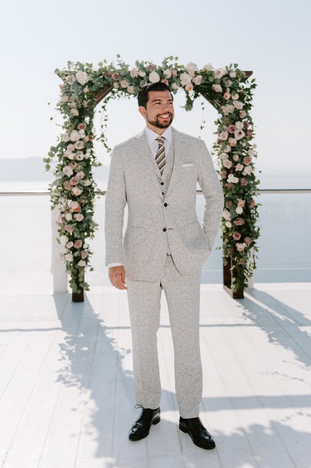 groom in grey flecked cream suit