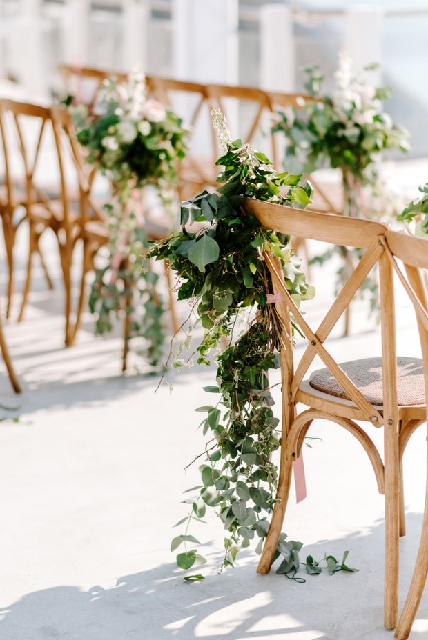 greenery draped wedding aisle