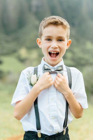 cute ring bearer with dino bow tie
