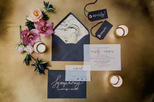 dramatic wedding invitation suite in black and gold
