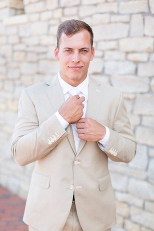 groom in sand color suite
