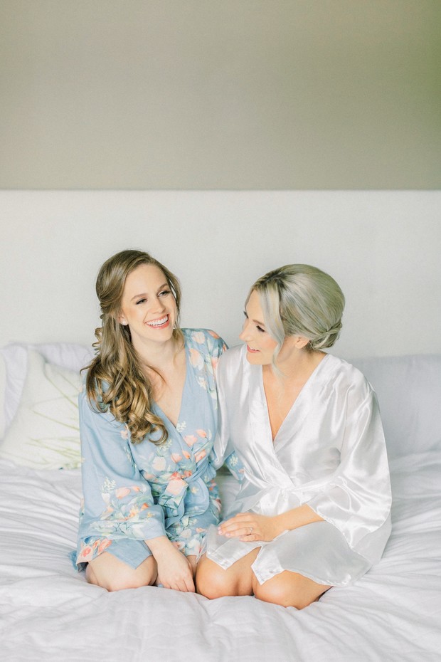Bride and mother sharing a moment in getting ready robes