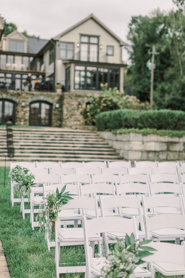 Outdoor wedding seating at a mansion venue on lawn