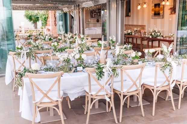 wedding reception in lush greenery and neutral tones