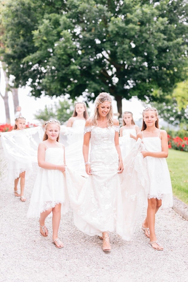 here comes the bride and all of her flower girls