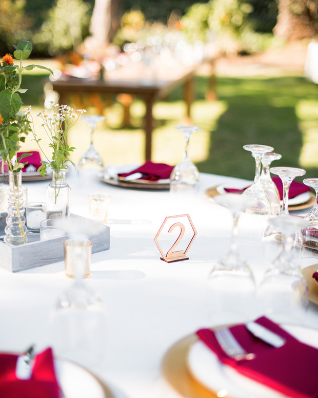 Outdoor wedding table setting with number two on the table