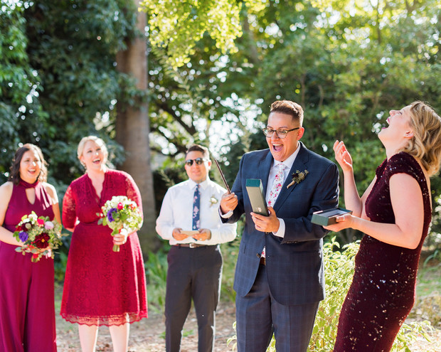 Joyful wedding moment with the couple and excited guests