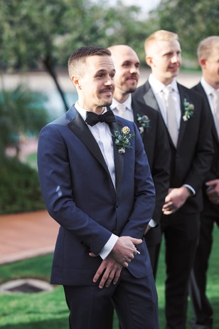 groom at the alter