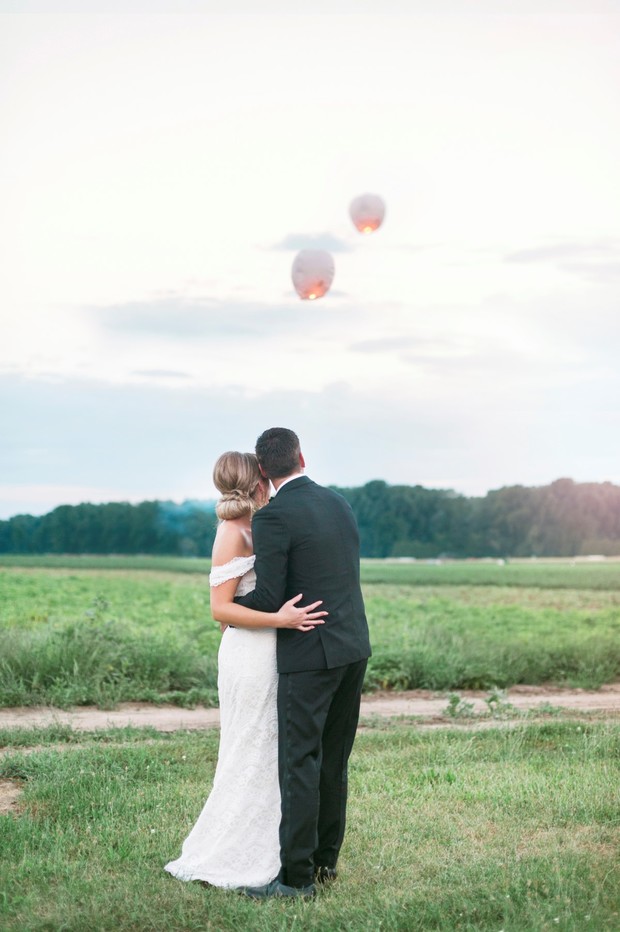 bride and groom release lanterns