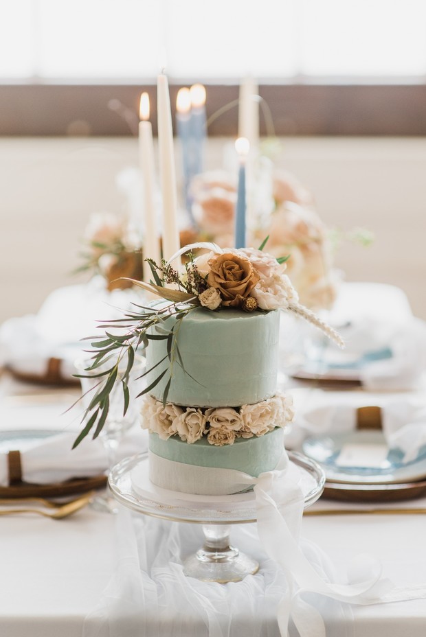 pale blue wedding cake with roses
