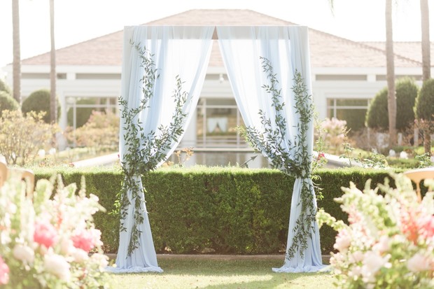 ceremony backdrop with greenery