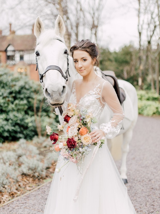 bride and white wedding horse