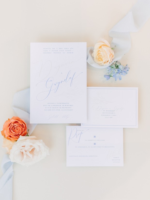 wedding invitations in blue calligraphy
