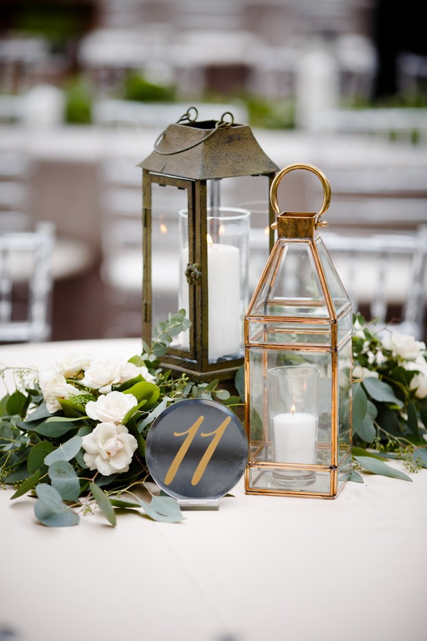 Wedding table centerpiece with lanterns and table number 11