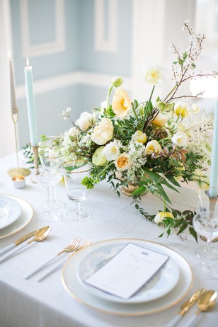 gold white and soft blue table decor