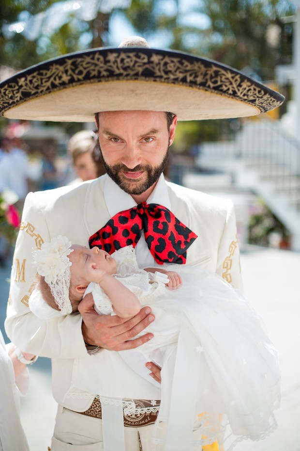 groom and baby in full matador outfit
