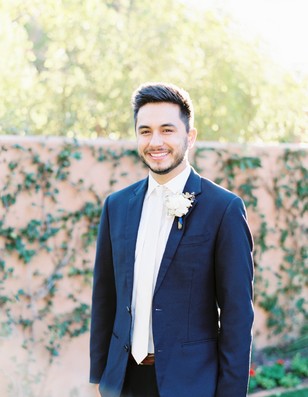 groom in white tie formal suit