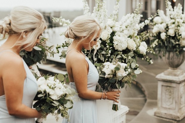 bridesmaids in soft blue with white bouquets