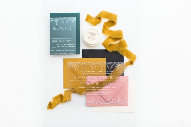 Wedding stationery with envelopes, ribbon, and a ring box