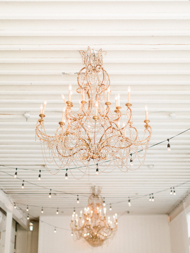 Elegant chandeliers and string lights hanging in a bright room