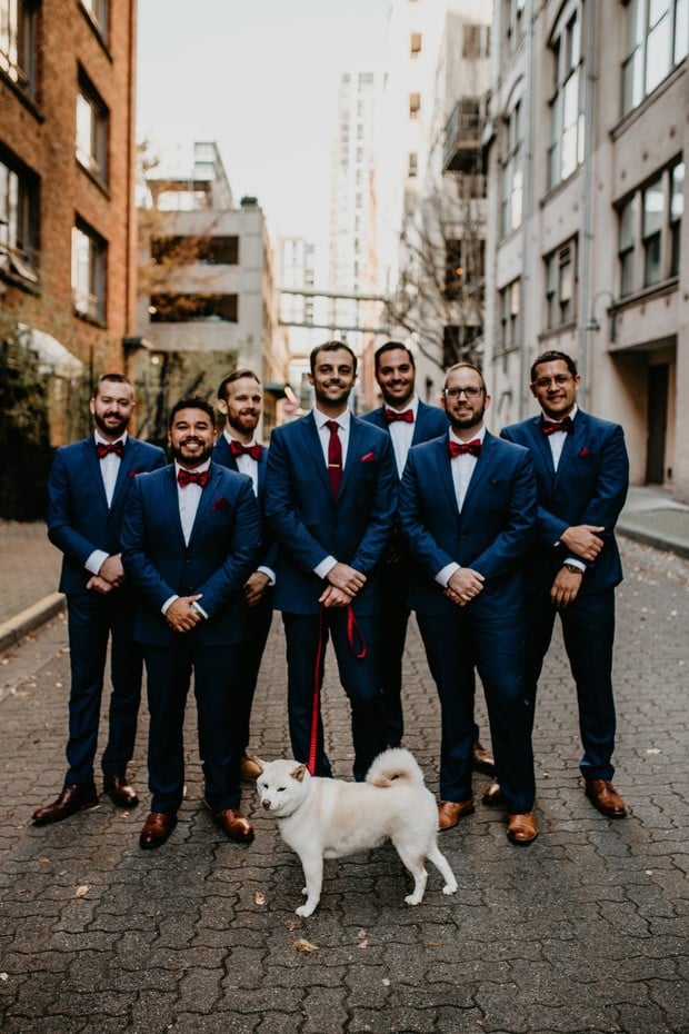 groom and his groomsmen in blue and burgundy