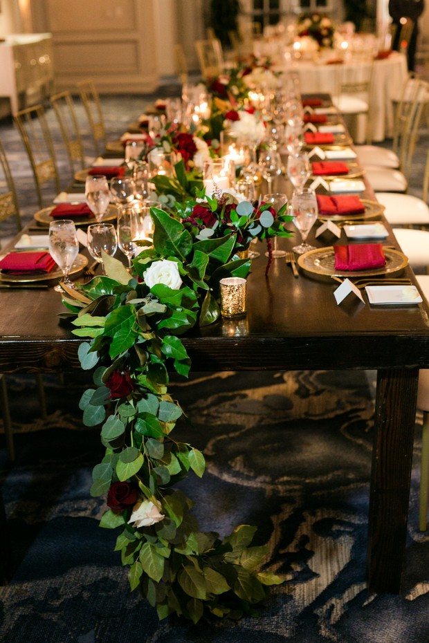 wedding table with rose and greenery garland