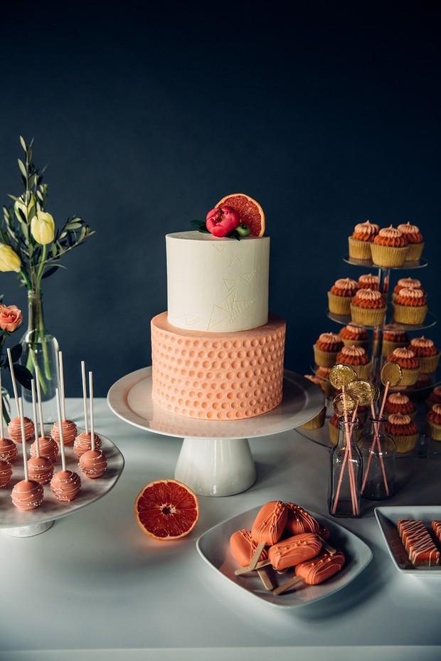 wedding cake in coral and grapefruit