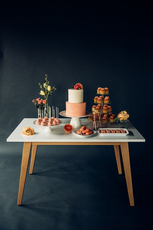 coral and blush wedding cake table