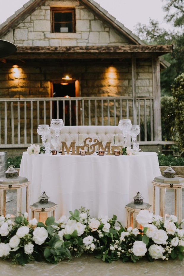white and gold wedding sweetheart table