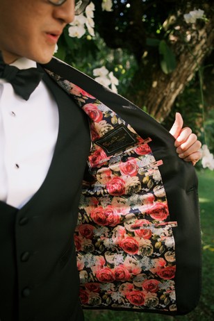 groom with floral jacket liner