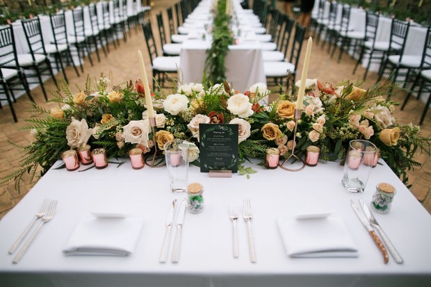 sweetheart table with blush and ivory floral decor