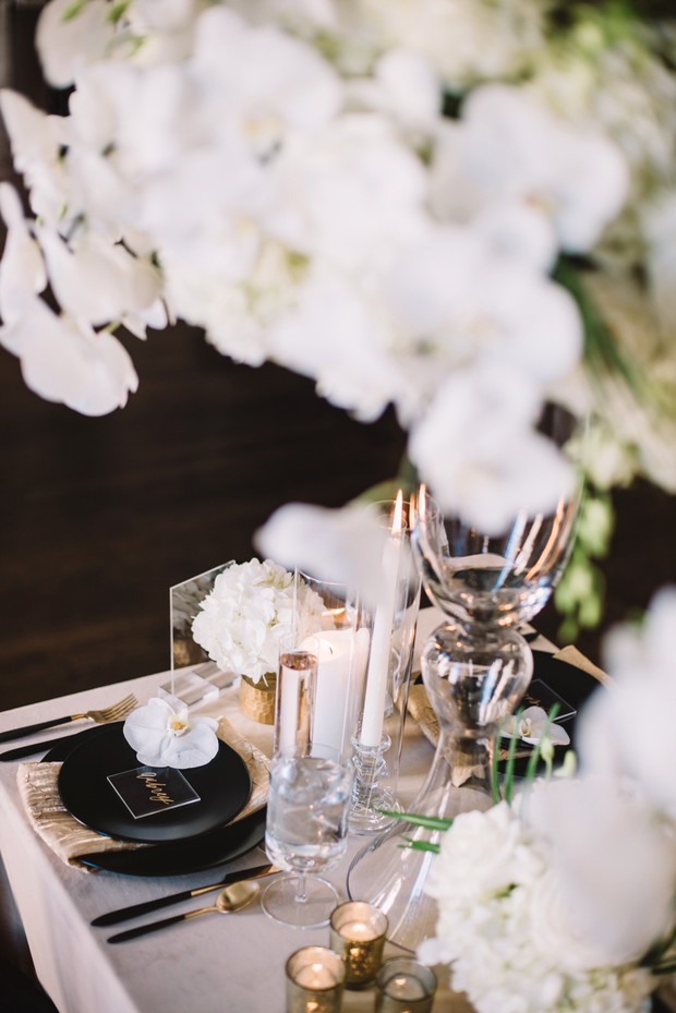 glam black and gold wedding table setting
