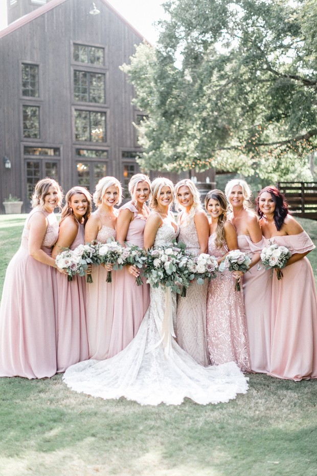 bridesmaids in mismatched blush gowns